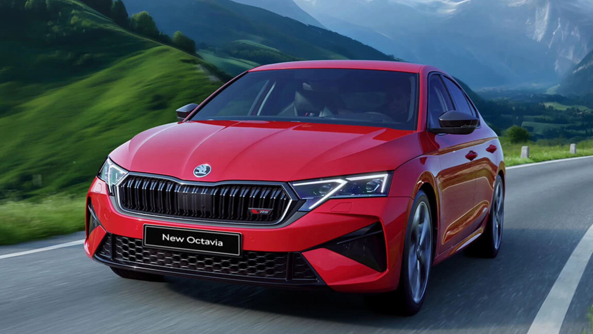 A red car driving on a road

Description automatically generated